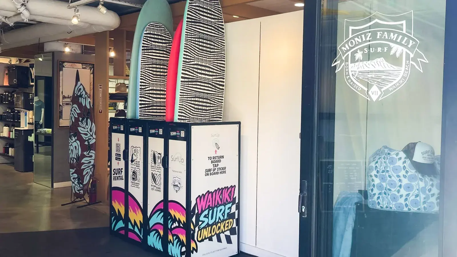 A SurfPod rental station in Waikiki with surfboards standing in its lockers